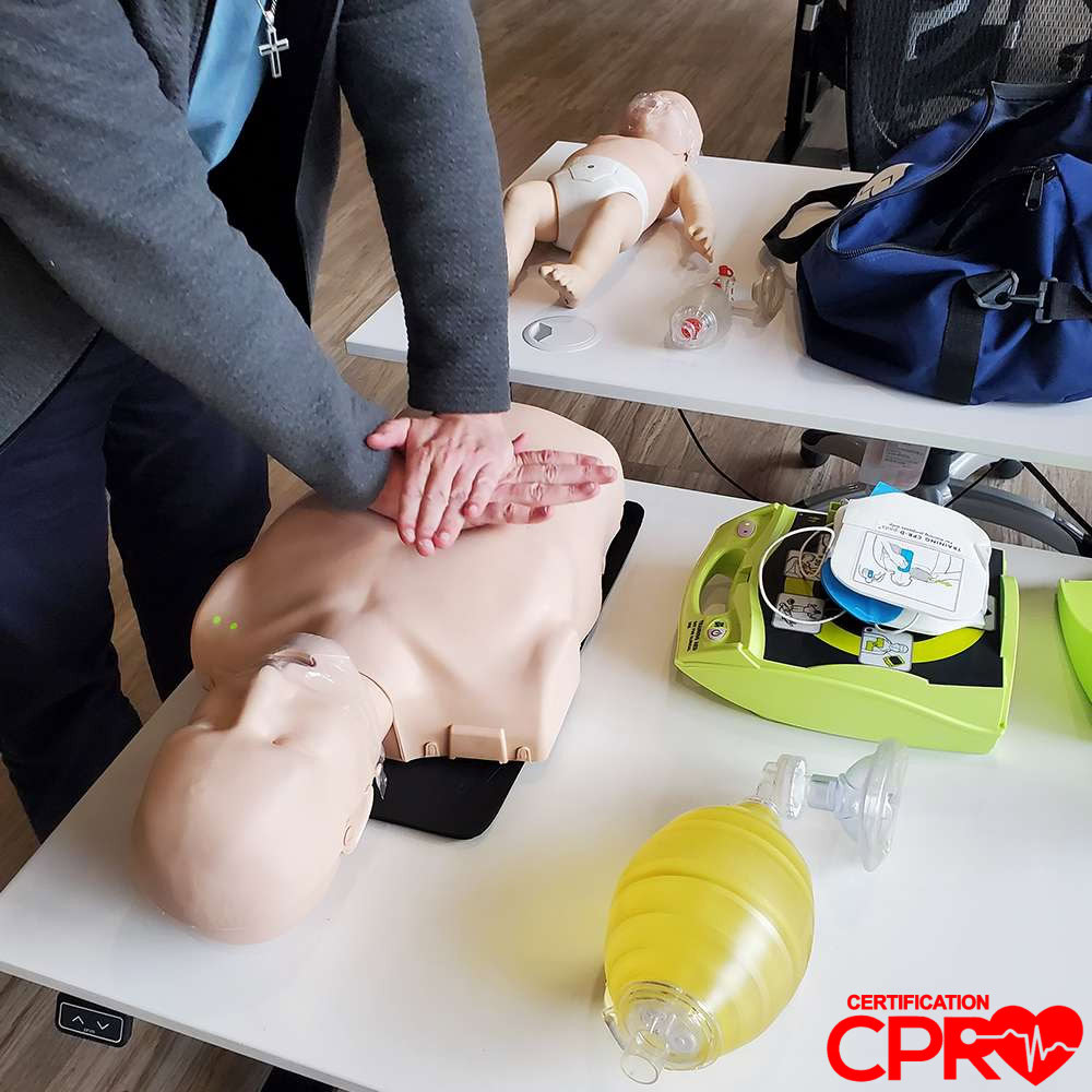 CPR training on mannequin for certification in Atlanta.