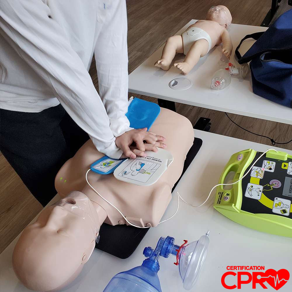 CPR training with mannequin and AED for certification in Atlanta.