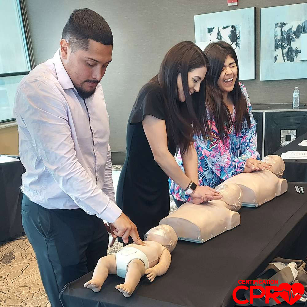 CPR training class in Atlanta with students practicing on mannequins.