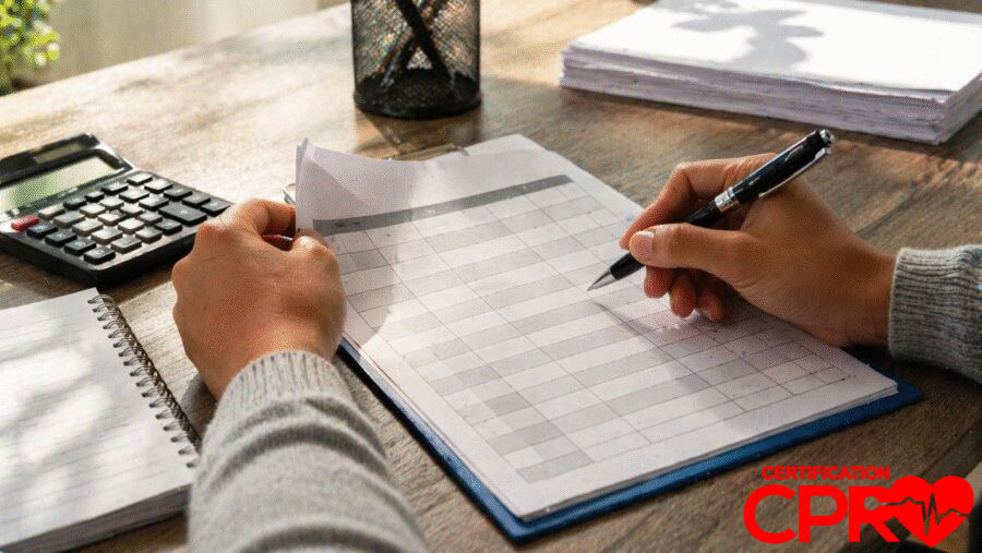 Person filling out a form for CPR certification in Atlanta, Georgia.